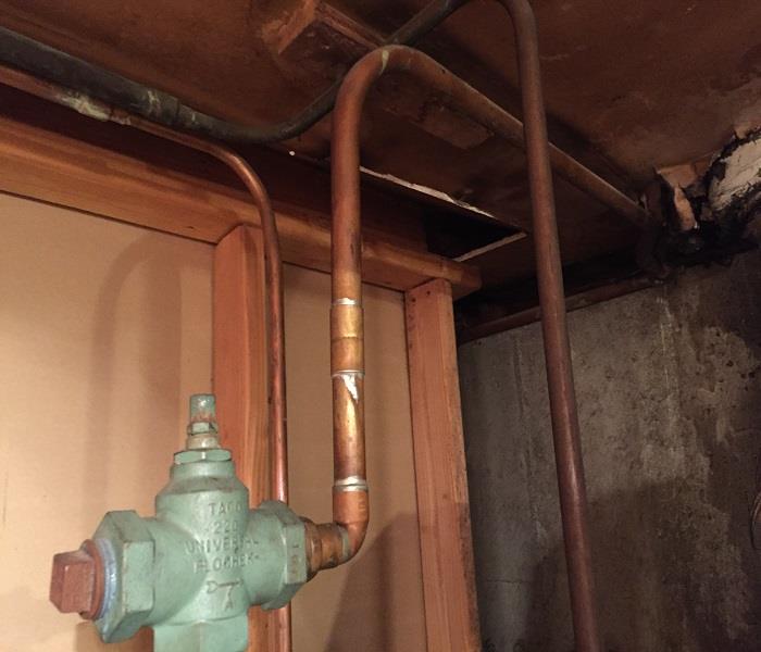 clean basement walls with boiler pipes
