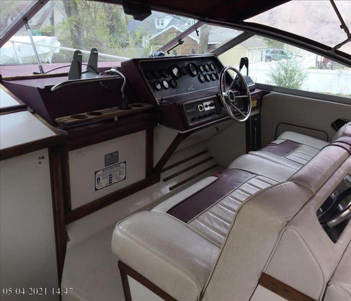 Interior of boat with clean seats and dash