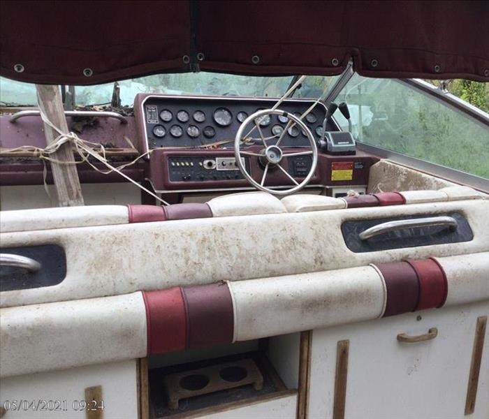 Boat with dirt and debris on the upholstery and surfaces