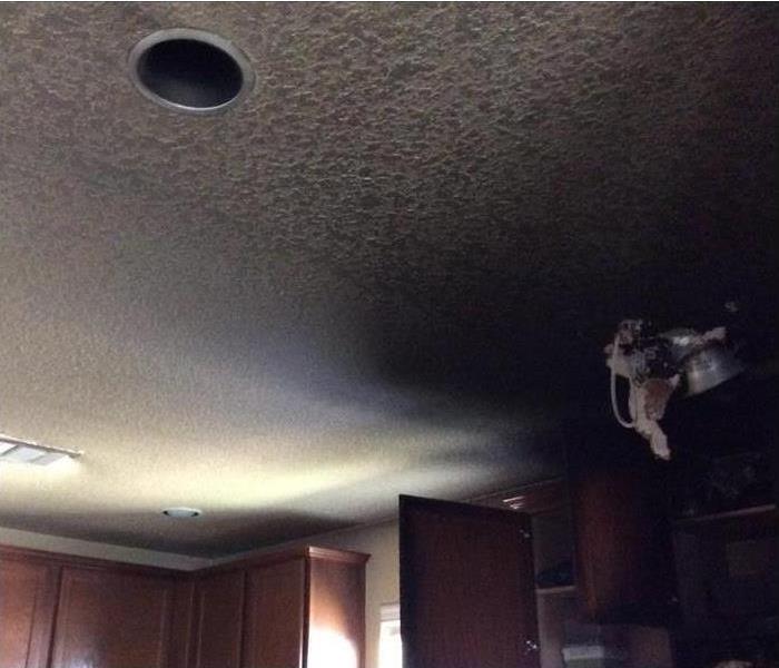 black soot on ceiling of kitchen