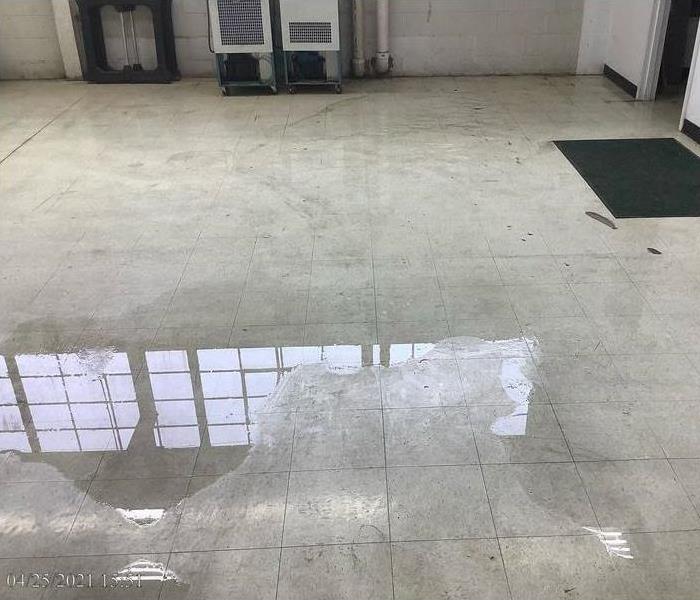 Business floor with standing water on tile