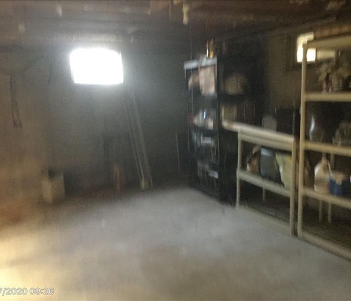 Basement with shelves that have items