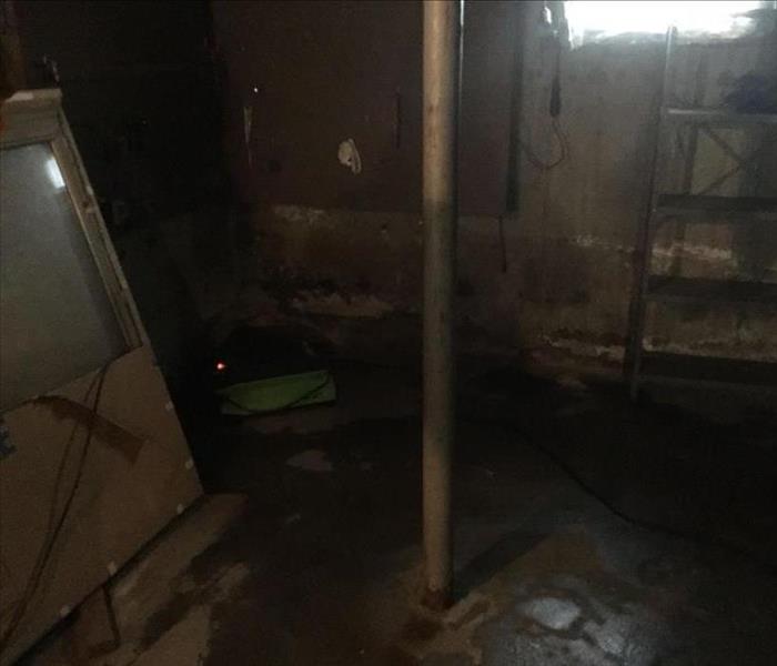 dark basement with flood damage, wet