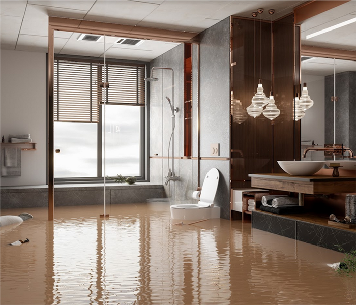 a flooded bathroom with water covering the floor